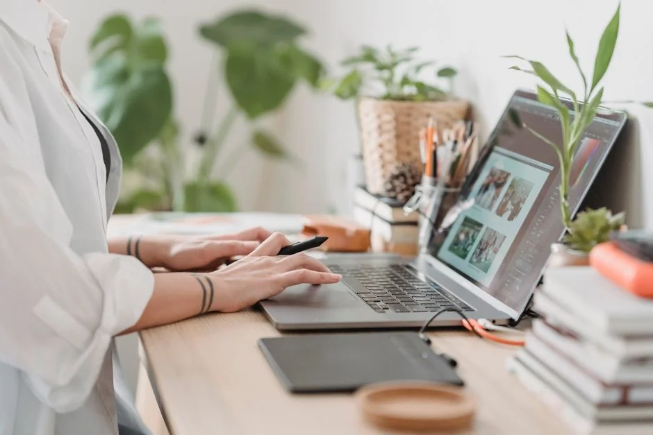 A clean and modern workspace featuring a laptop, tablet, smartphone, and monitor. Ideal for remote work and tech setups.